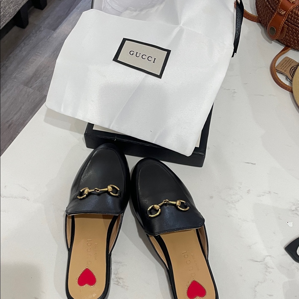 Black leather loafers with adorable hooks on front and heart